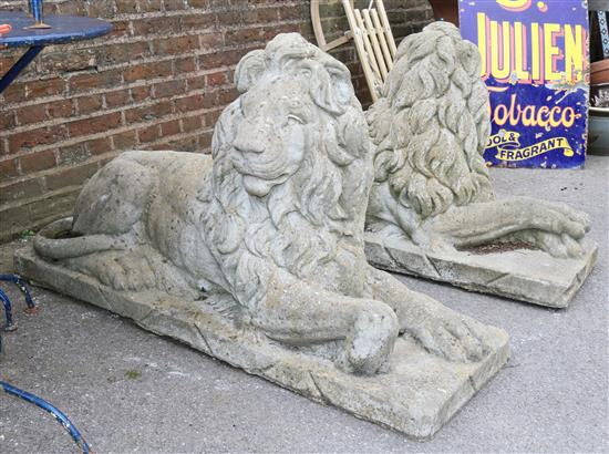 A pair of reconstituted stone garden statues modelled as seated lions, 4ft